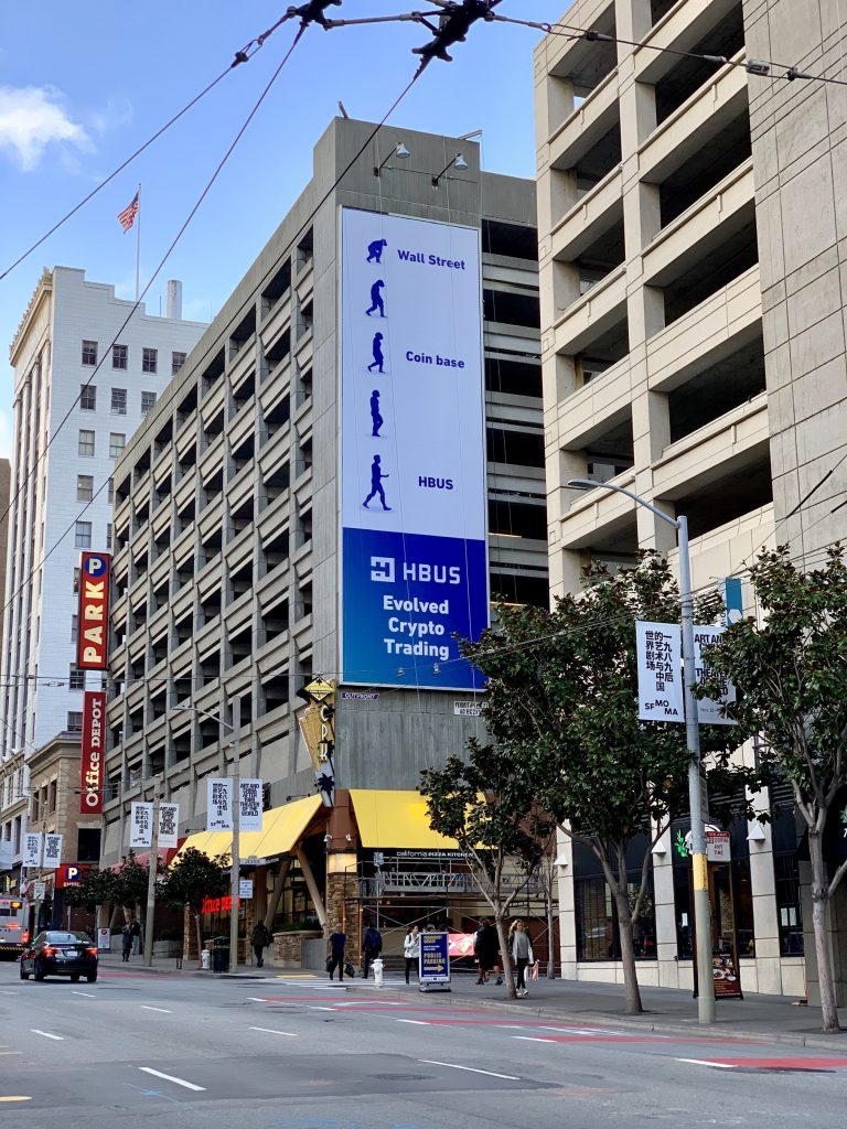 HBUS Evolved Crypto Trading Billboard Debuts On San Francisco Building, Jabbing At Coinbase