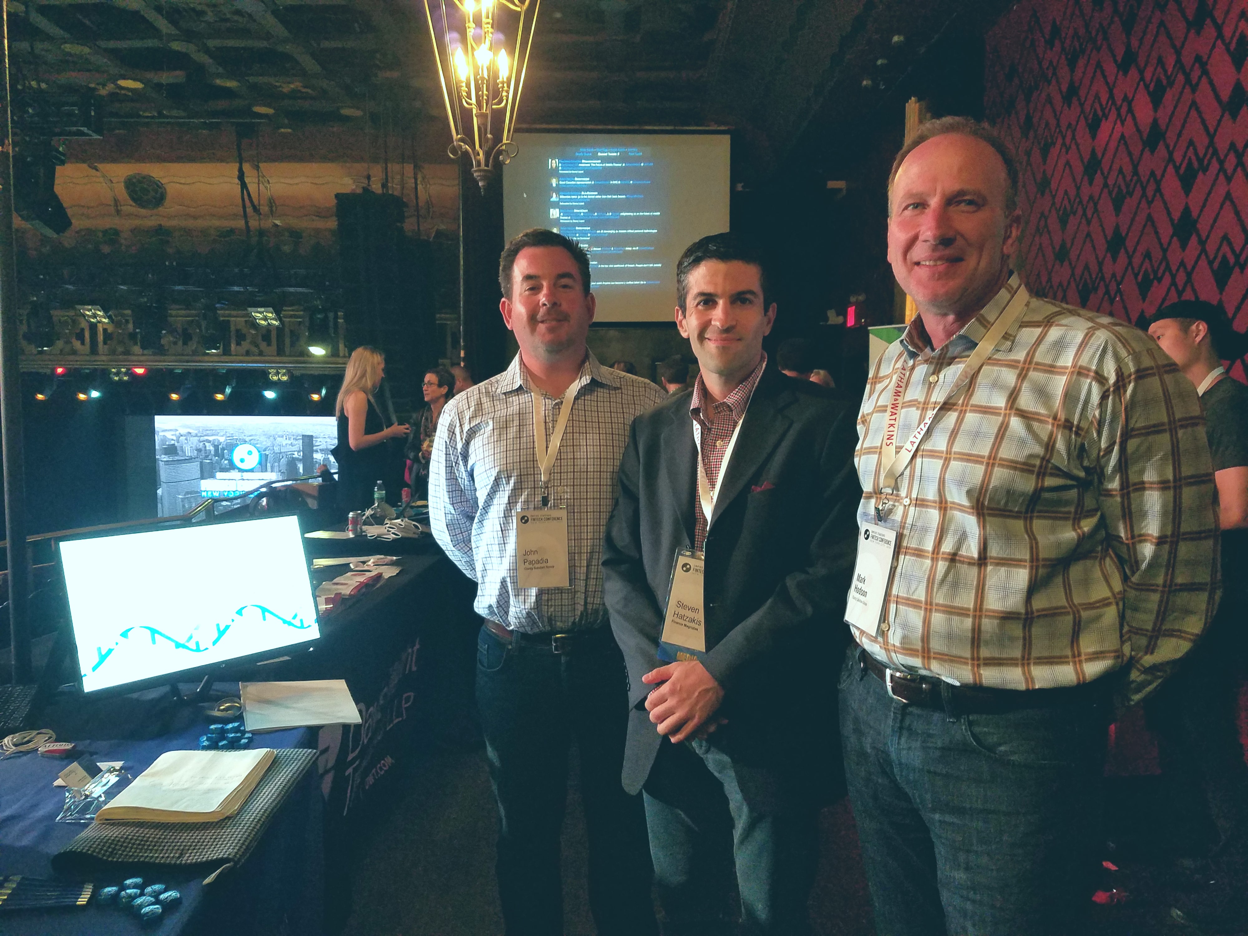 Finance Magnates' Editor Steven Hatzakis (middle) meets with John Papadia (left), President and Founder of Clarity Solutions Group, and Mark Hodson (right), Vice President of Clarity Solutions Group at the company's exhibitor booth at the Empire Startups Fintech NY conference April 28, 2016.