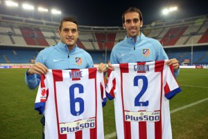 Atletico Madrid players, Gabi and Koke, display the new club shirt with the Plus500 logo (Photo Credit: Business Wire)